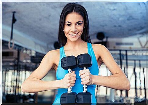 Woman doing exercise with weights