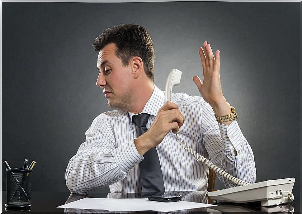 man avoiding talking on the phone