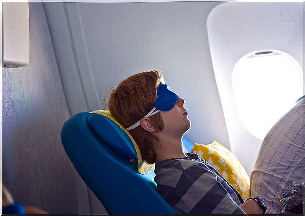 boy sleeping on the plane