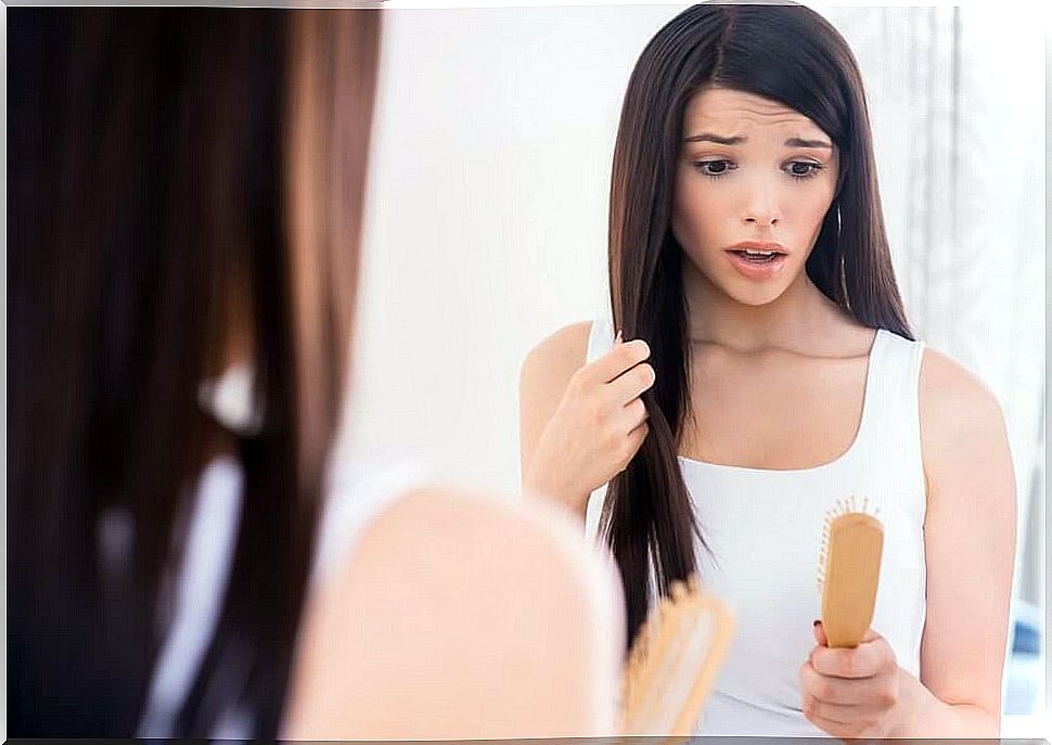 Woman surprised by her hair loss