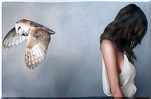 Sad and upset girl because of her past represented by an owl