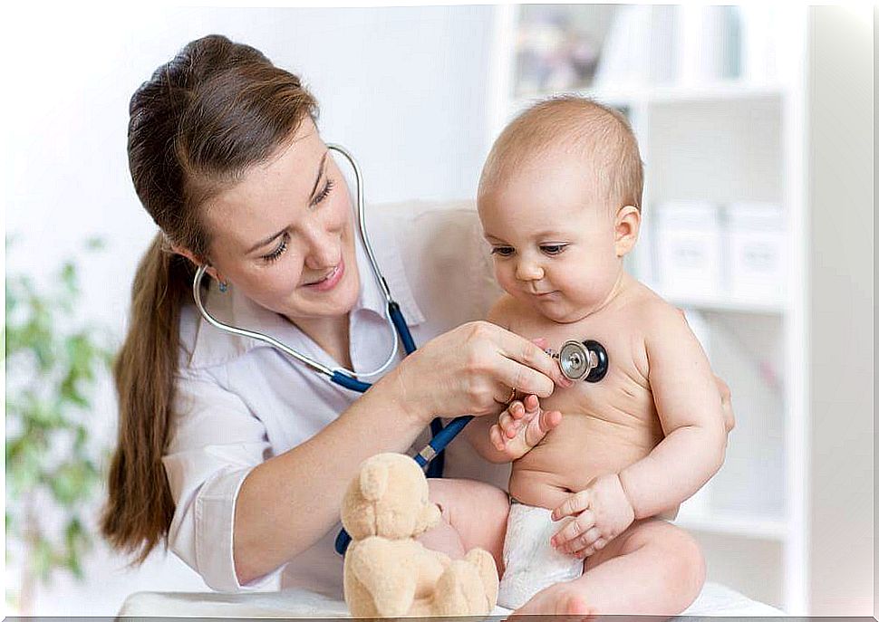 Doctor treating constipation in a baby