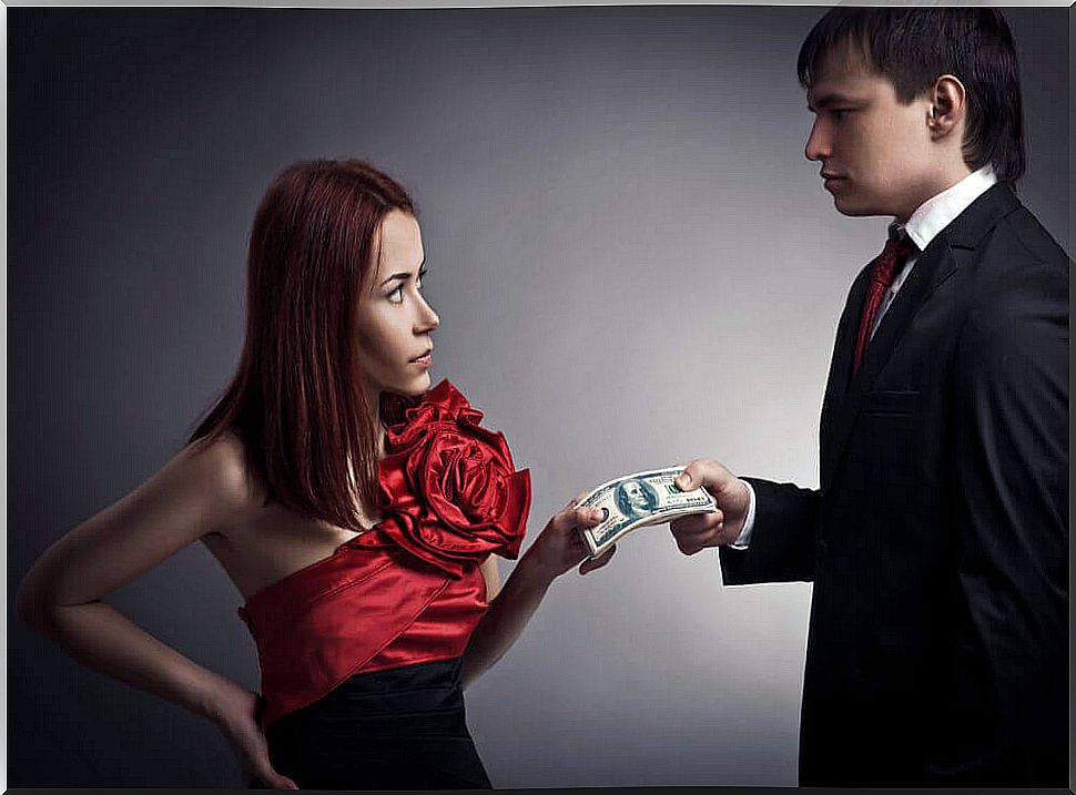 man giving money to woman