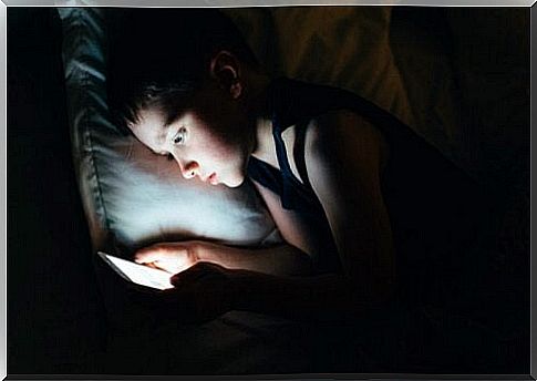 boy using tablet before bedtime