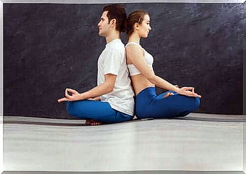 couple practicing yoga